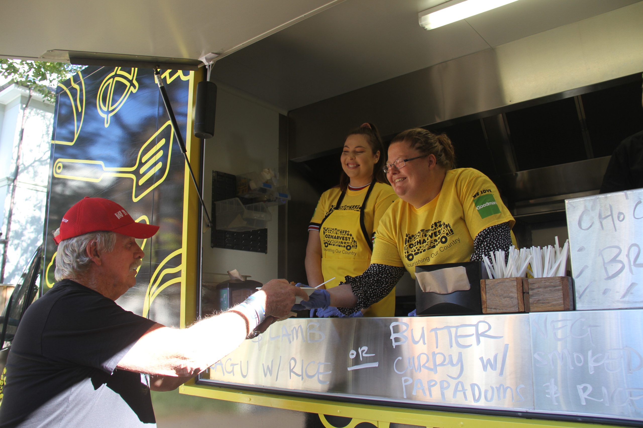 OzHarvest Food Truck passing food