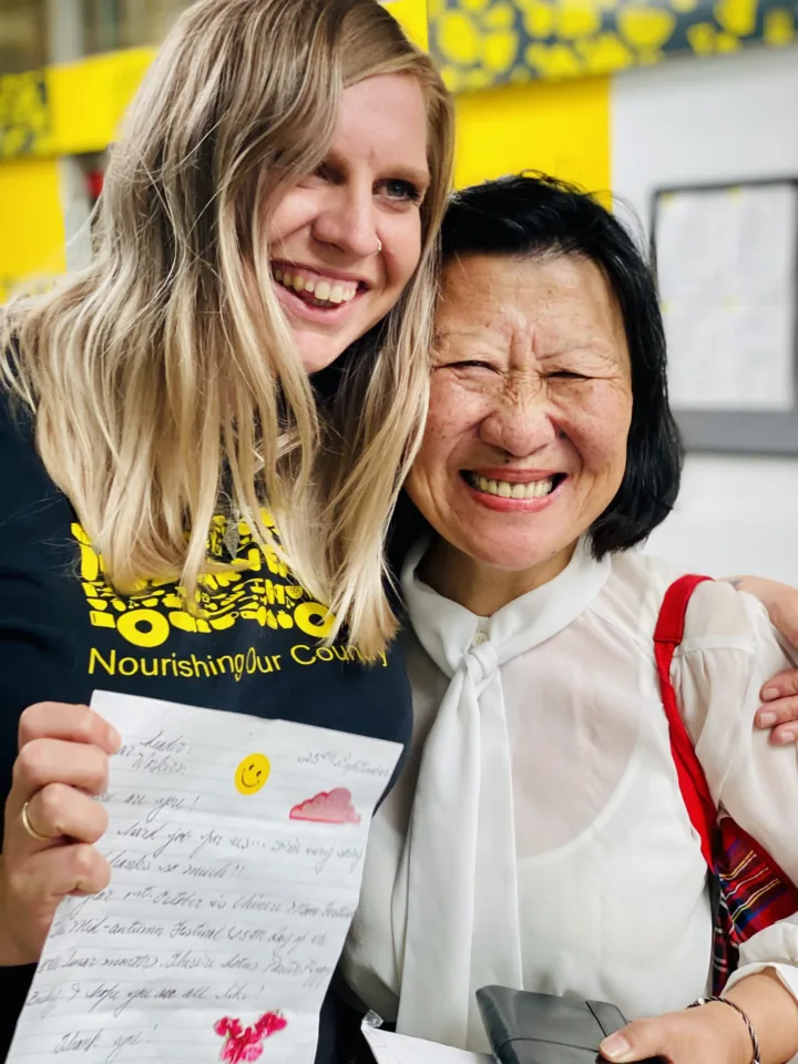 OzHarvest staff member hugging a food recipient.