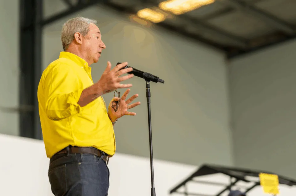 OzHarvest CEO James Goth speaking to attendees at community event.