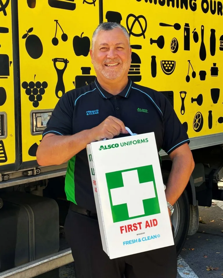 Fresh & Clean CEO standing in front of an OzHarvest food rescue truck.